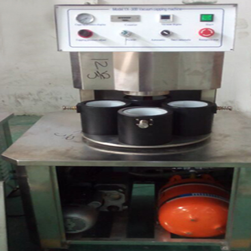 illustration of vacuum capping machine semi automatic Illustration zum Vakuumverschließen.jpg